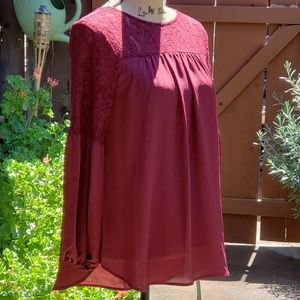 Beautiful burgandy blouse with sheer lace shoulder